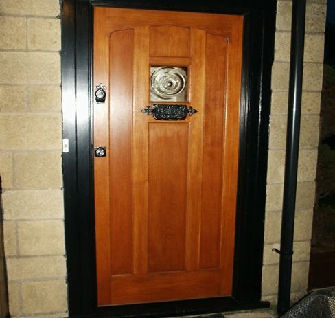 Hardwood front door with a cast iron knocker