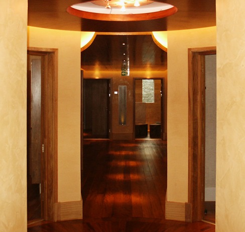 Circular lobby with a timber ceiling and hardwood floor