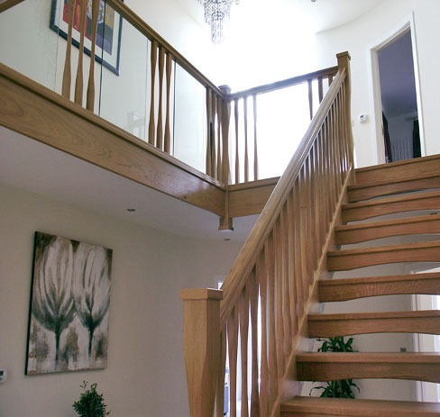 Oak staircase with a glass and oak galleried landing
