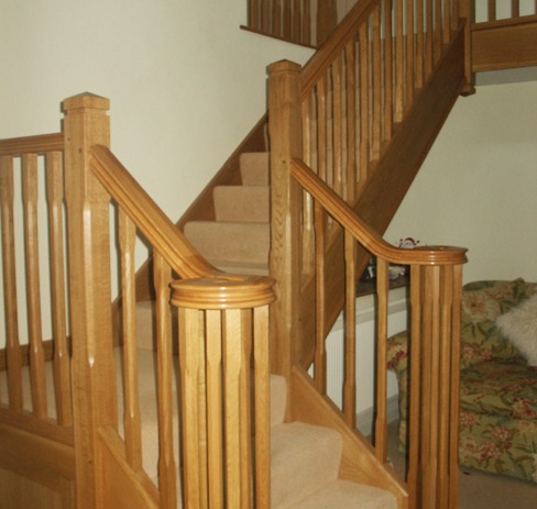 Oak staircase with a newel cap and a winder turn