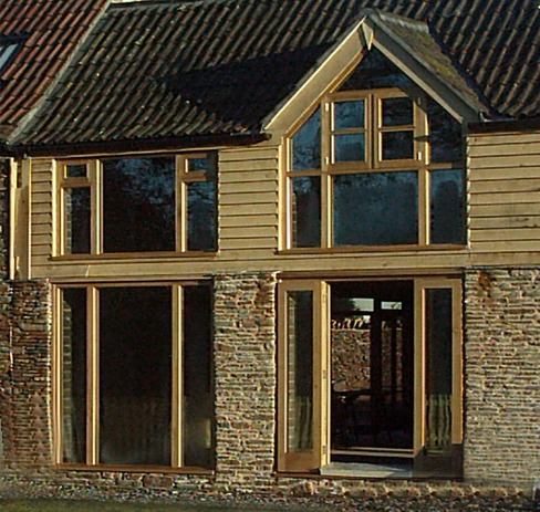 Oak framed glazing on a timber clad barn conversion